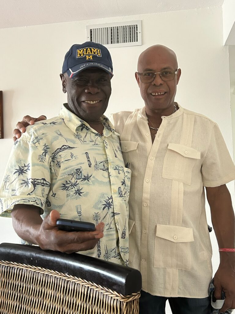 Two community members smiling side by side