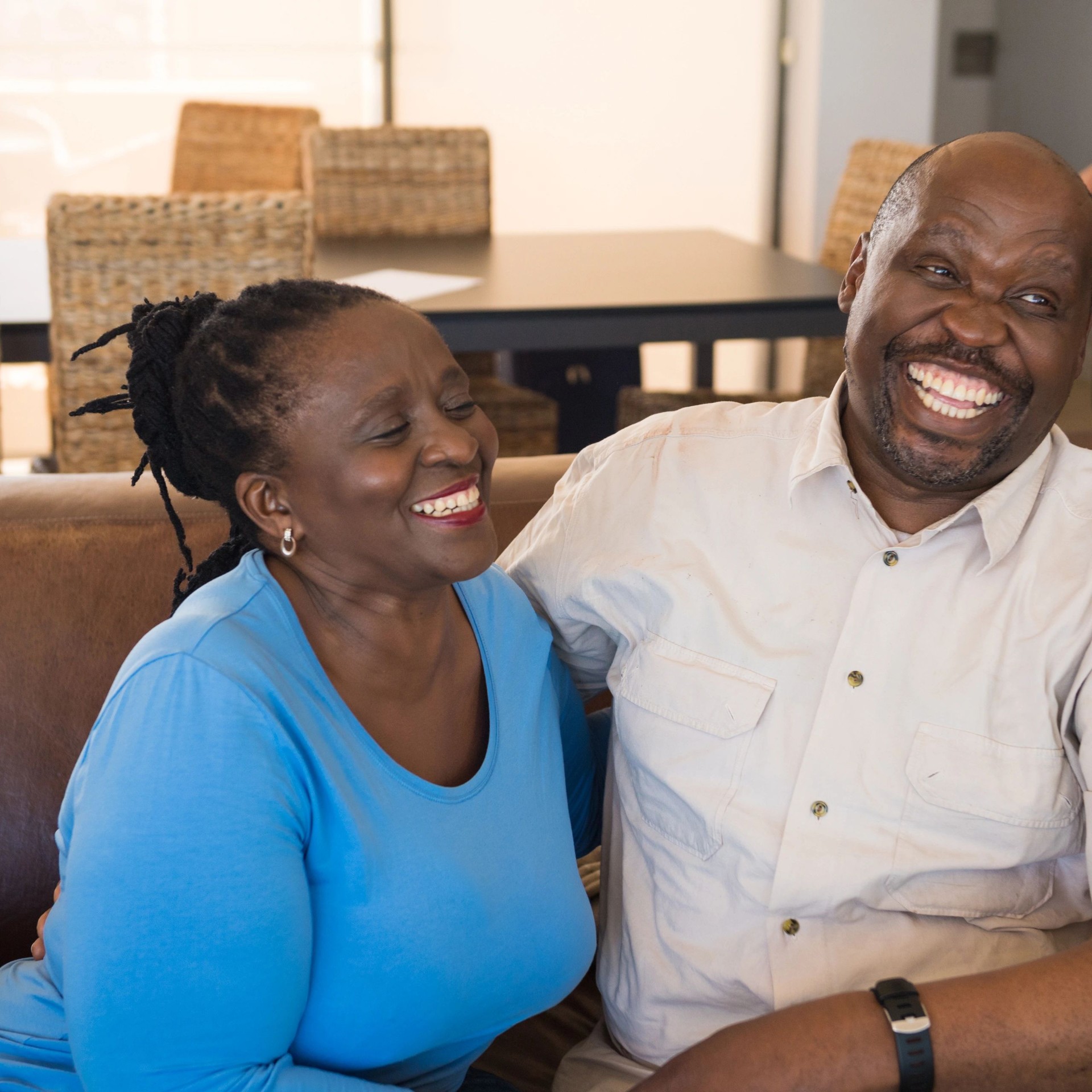 Senior couple laughing together at home